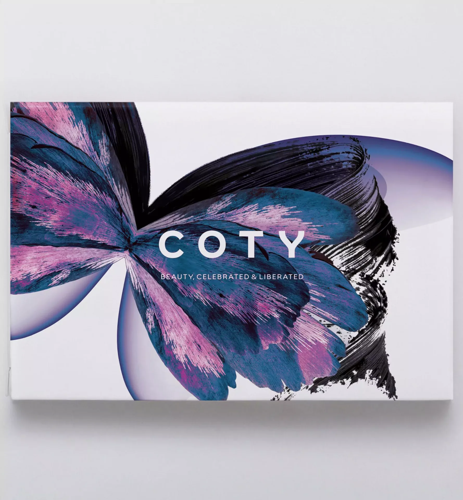 COTY brand logo overlaid on a stylized purple butterfly artwork
