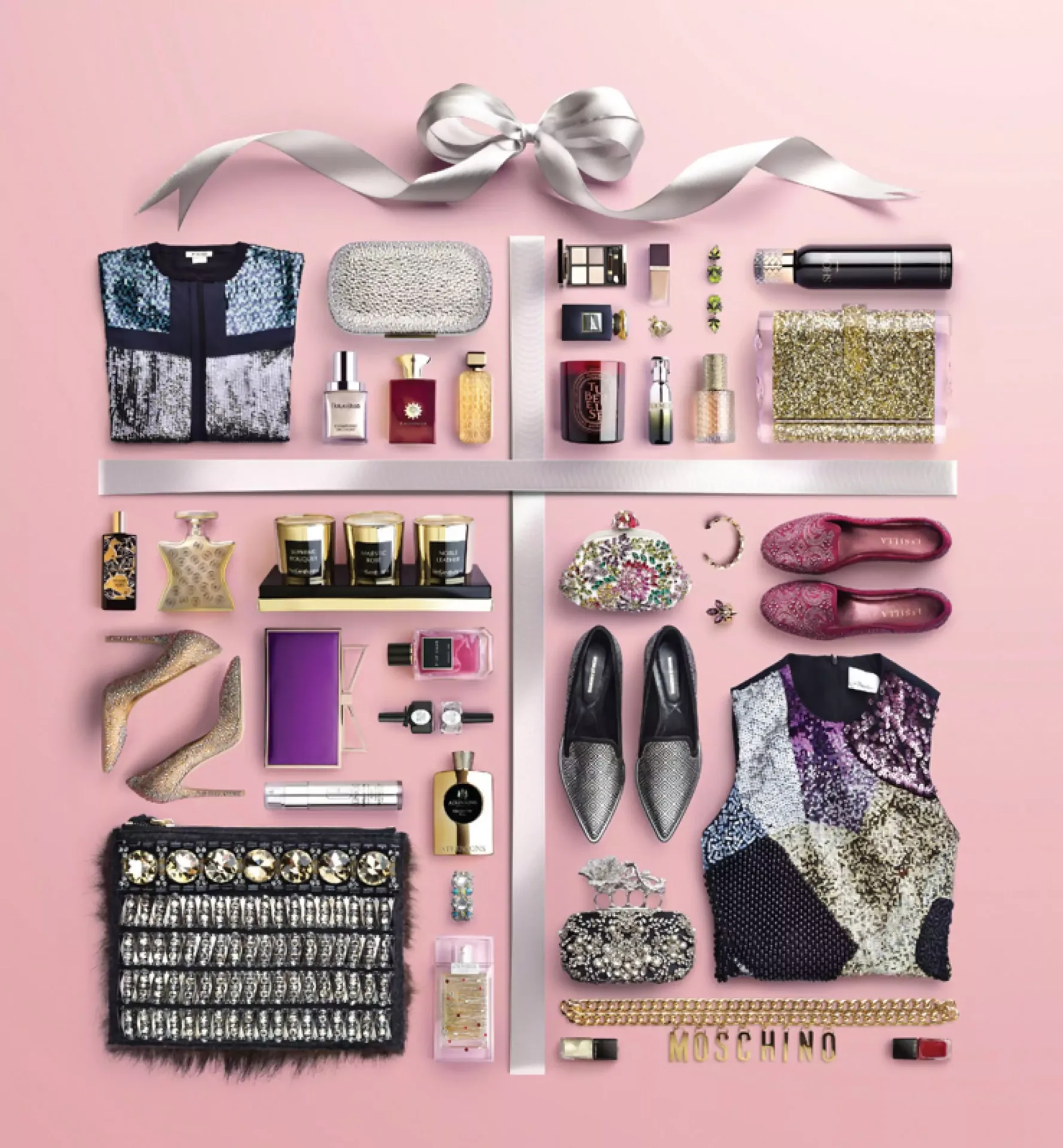 Flat lay arrangement of luxury fashion accessories, cosmetics, shoes, and gourmet products on a pink background
