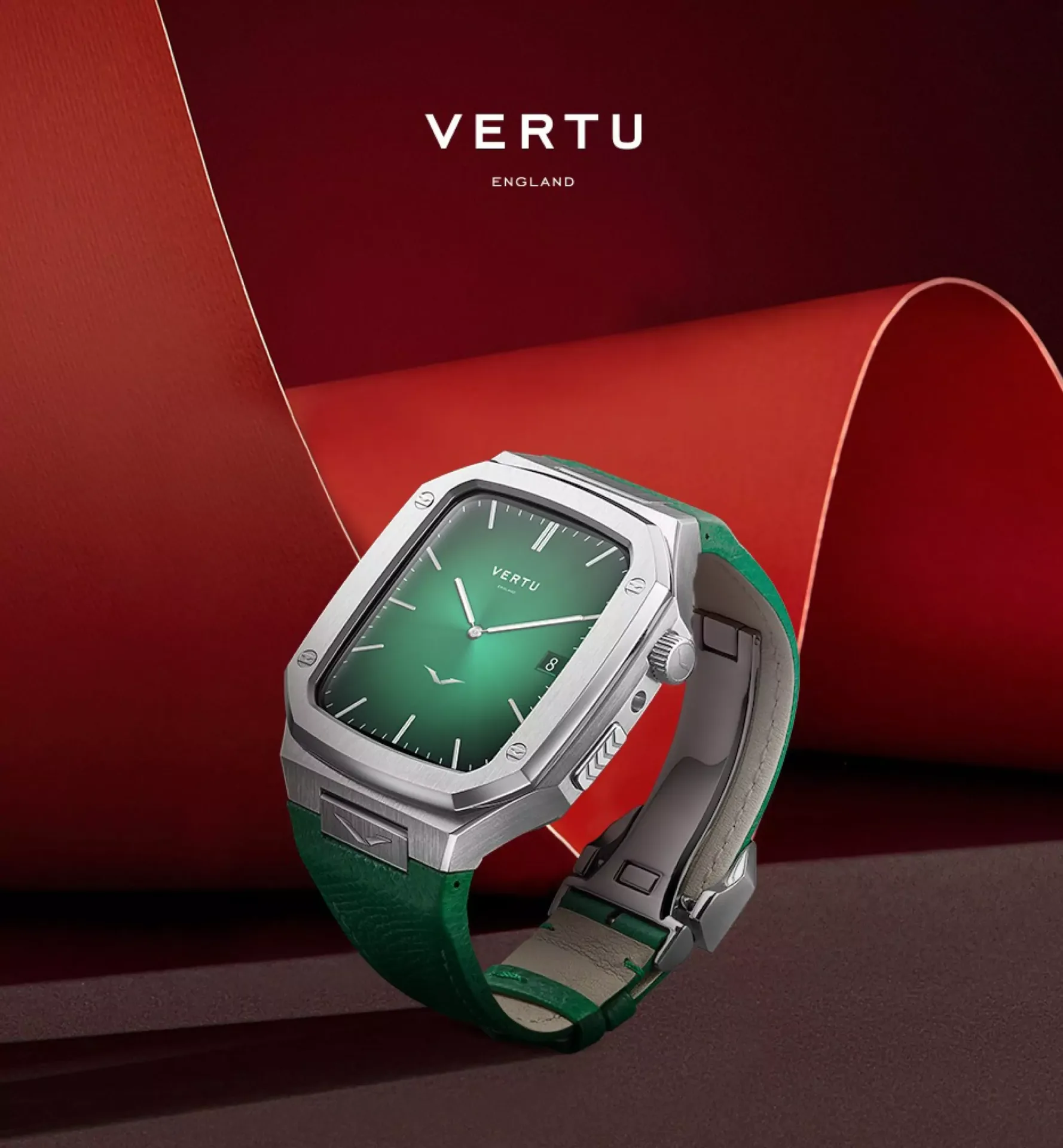 Luxury smartwatch with green strap and green face set against a sweeping red curved background